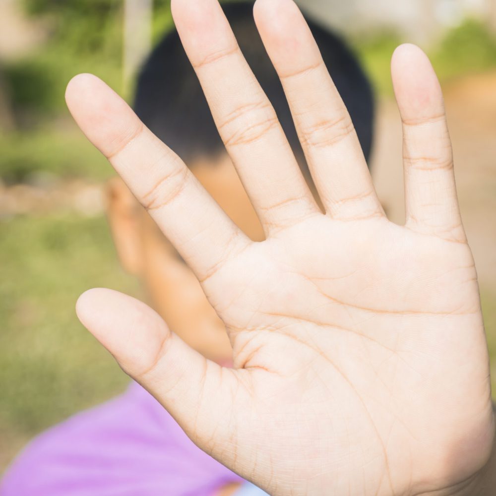male-teenager-showing-stop-sign-by-hand-over-his-f-2024-12-05-09-50-36-utc